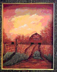 A barn scene at sunset.